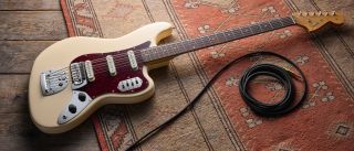 Fender Vintera III Early '60s Bass VI in Olympic White with red tortoiseshell pickguard.