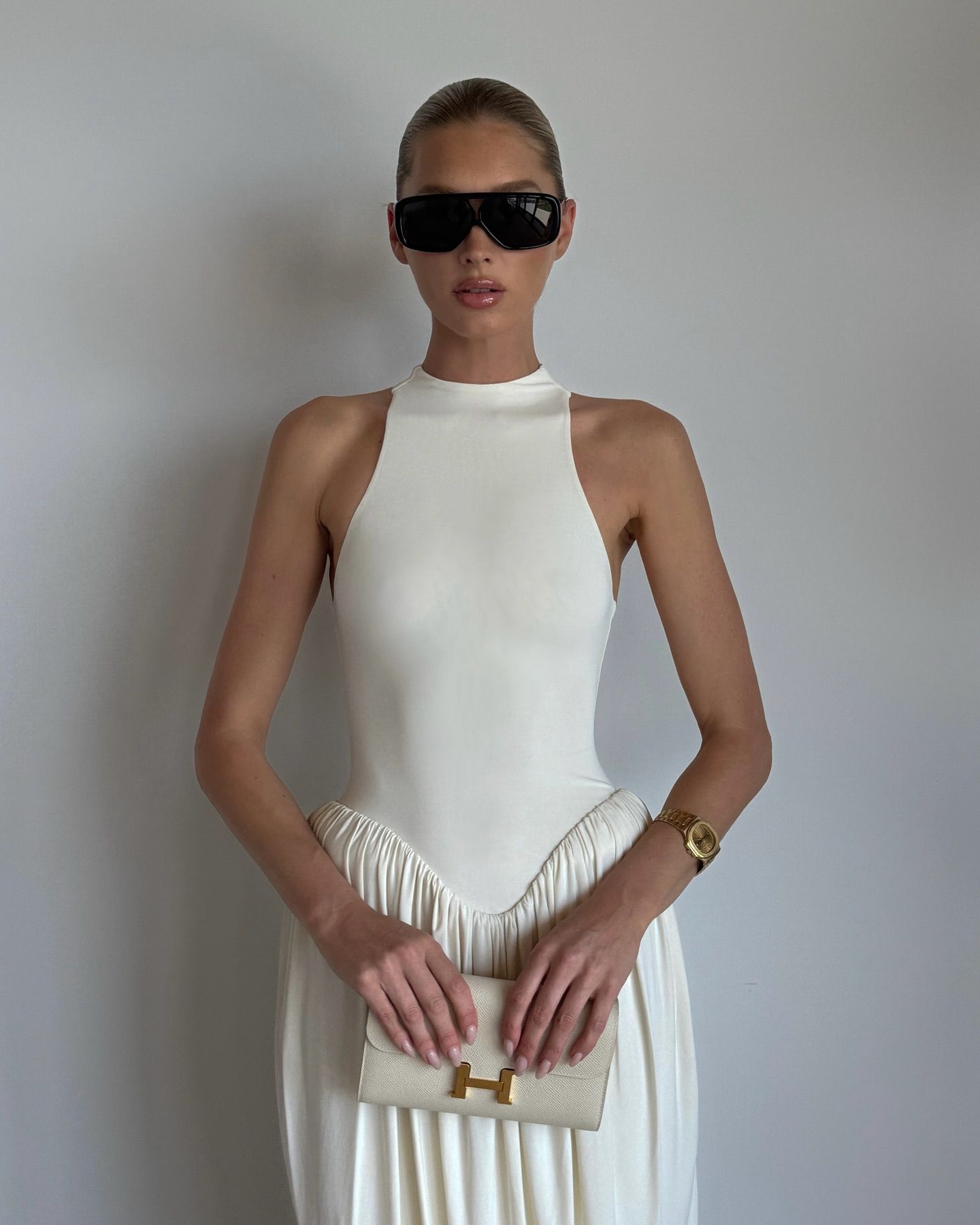 An image of Elsa Hosk wearing one of the best luxury watches for women.