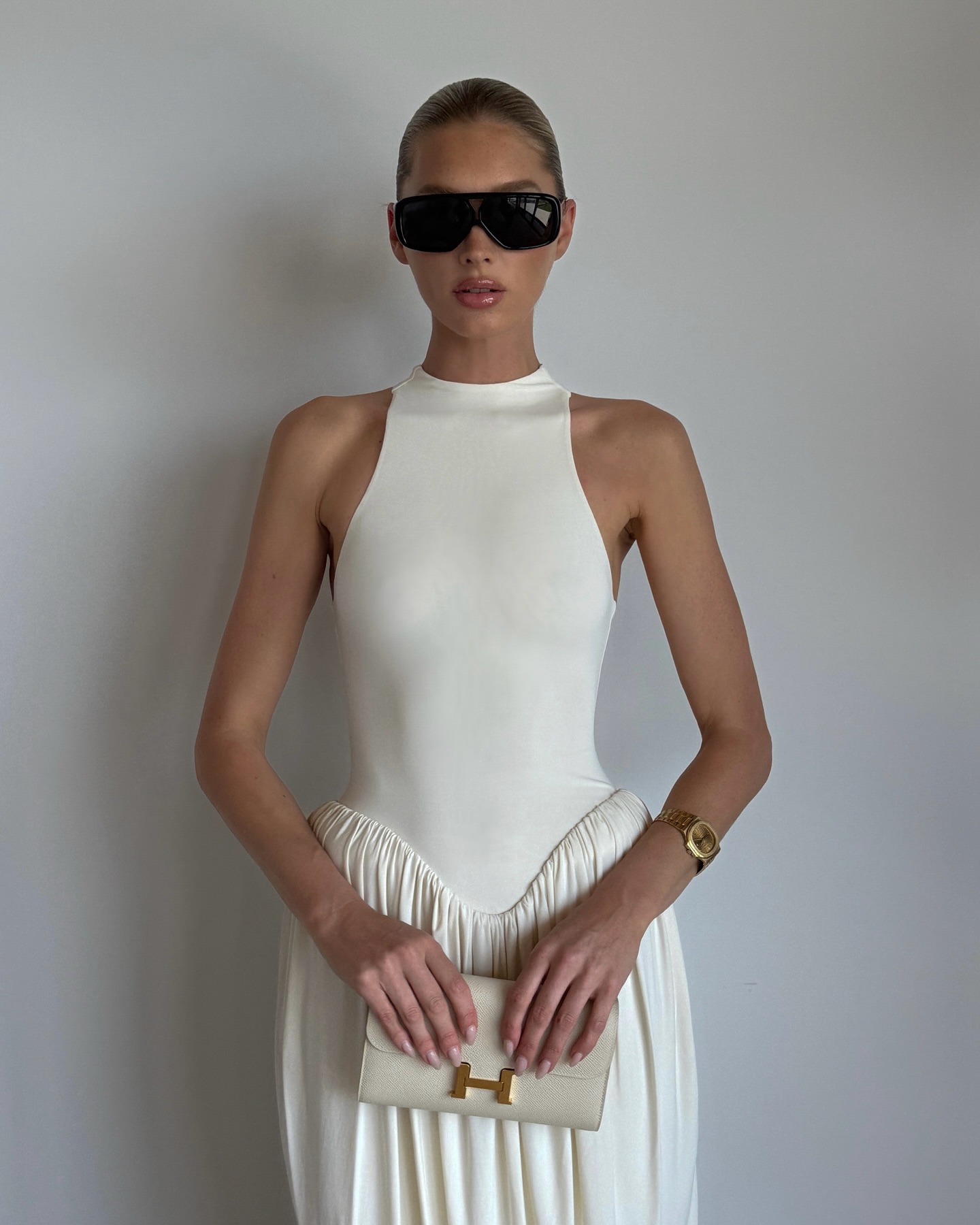 An image of Elsa Hosk wearing one of the best luxury watches for women.