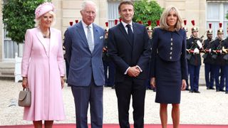 Queen Camilla, King Charles III, President of France Emmanuel Macron and France's first lady Brigitte Macron pose at the Elysee Presidential Palace