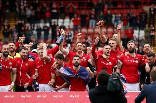 Players of Wrexham celebrate victory and promotion into League One following the Sky Bet League Two match between Wrexham and Forest Green Rovers at Racecourse Ground on April 13, 2024 in Wrexham, Wales. (Photo by Charlotte Tattersall/Getty Images) (Photo by Charlotte Tattersall/Getty Images)