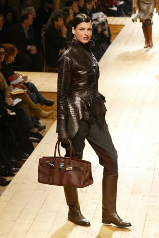 A model walks down the runway at the Fall 2004 Hermes show in Paris.