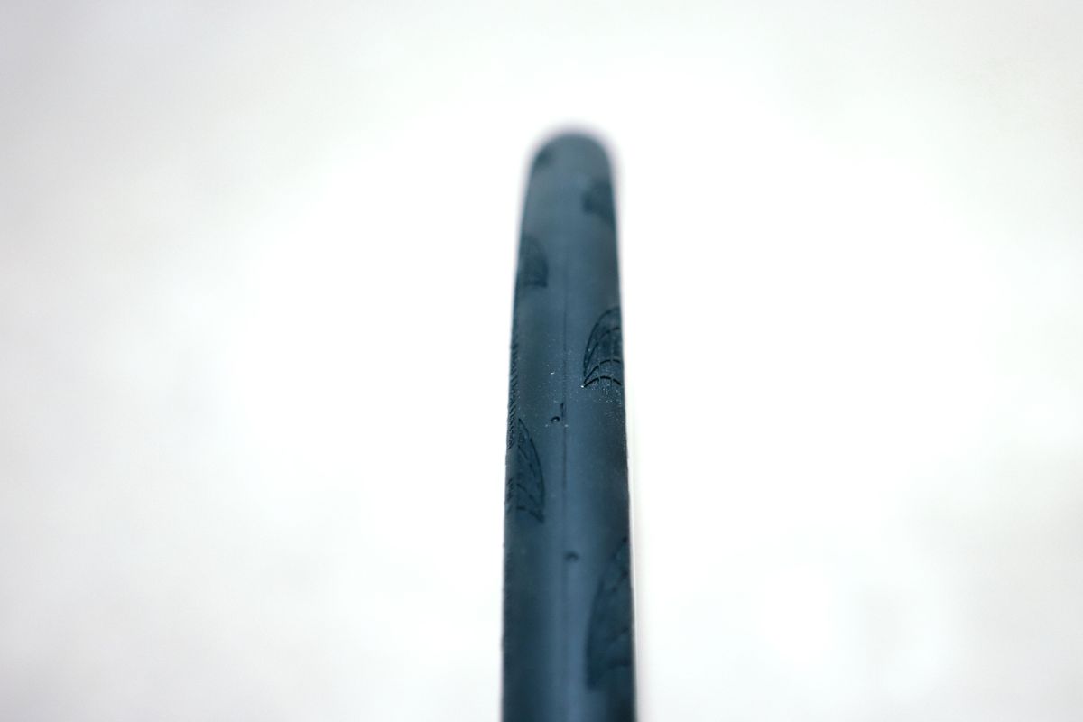a close up of a black road bike tyre