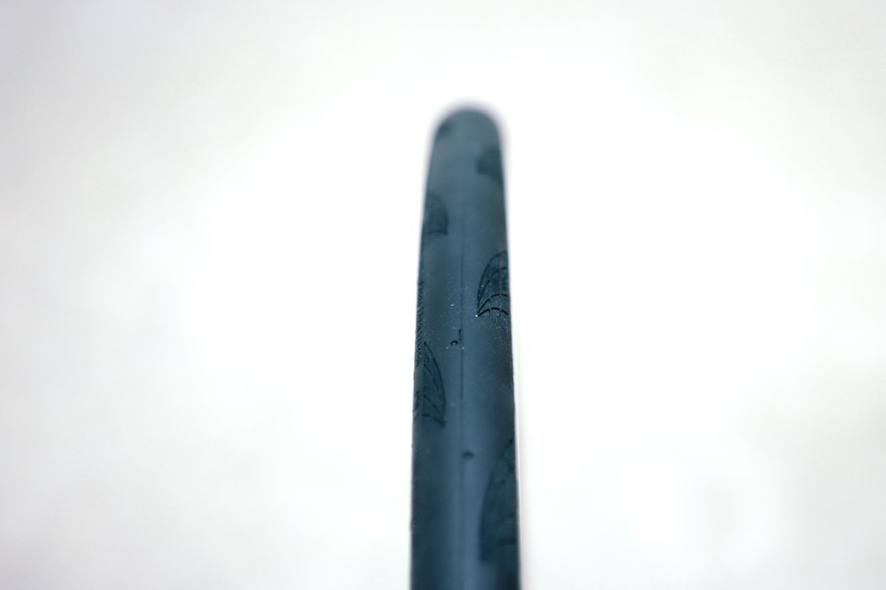 a close up of a black road bike tyre