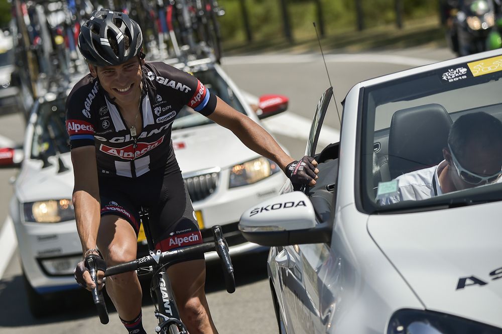 Warren Barguil rides next to the medical vehicle during the 2015 Tour de France