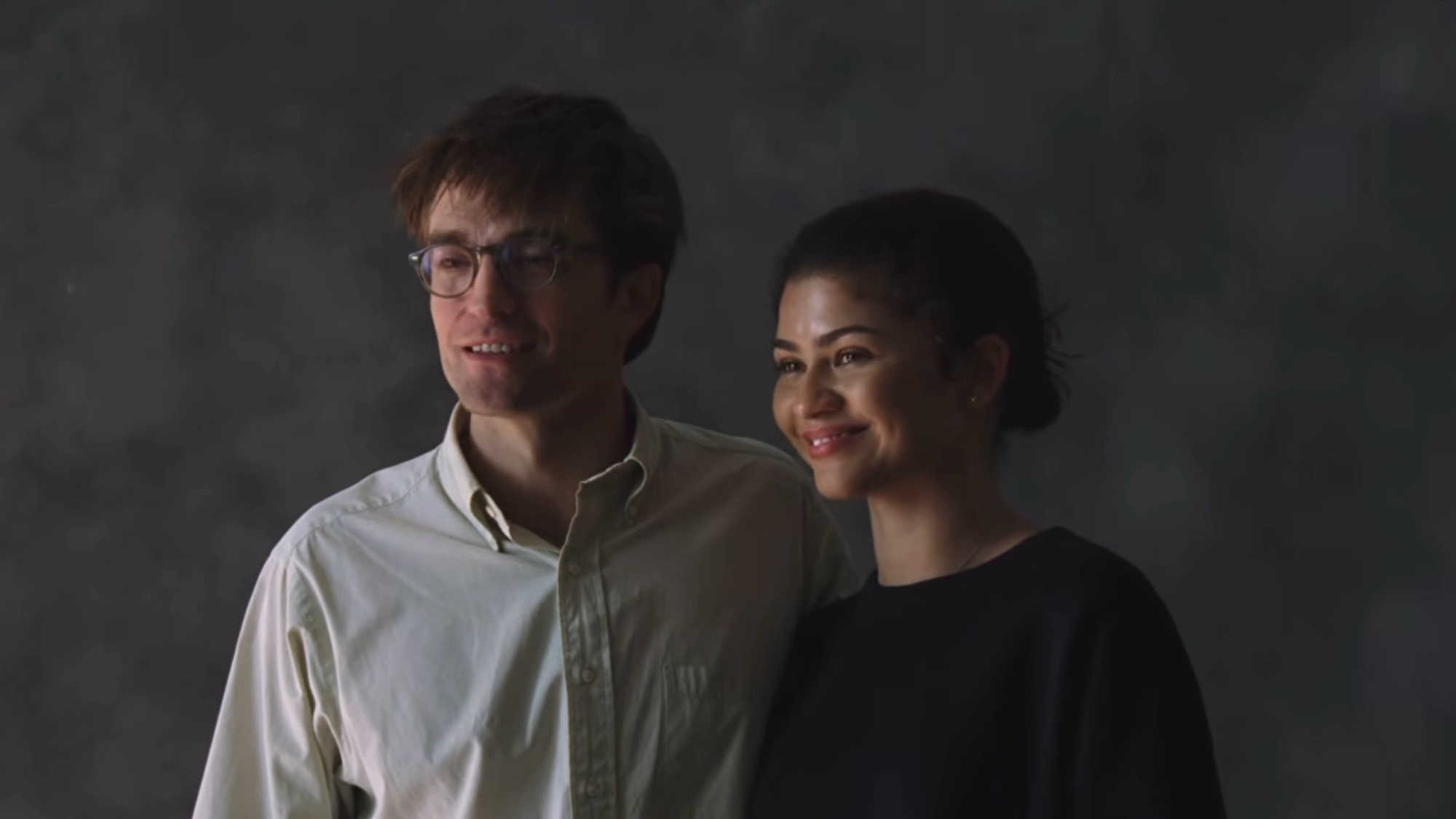Robert Pattinson and Zendaya posing awkwardly in The Drama.
