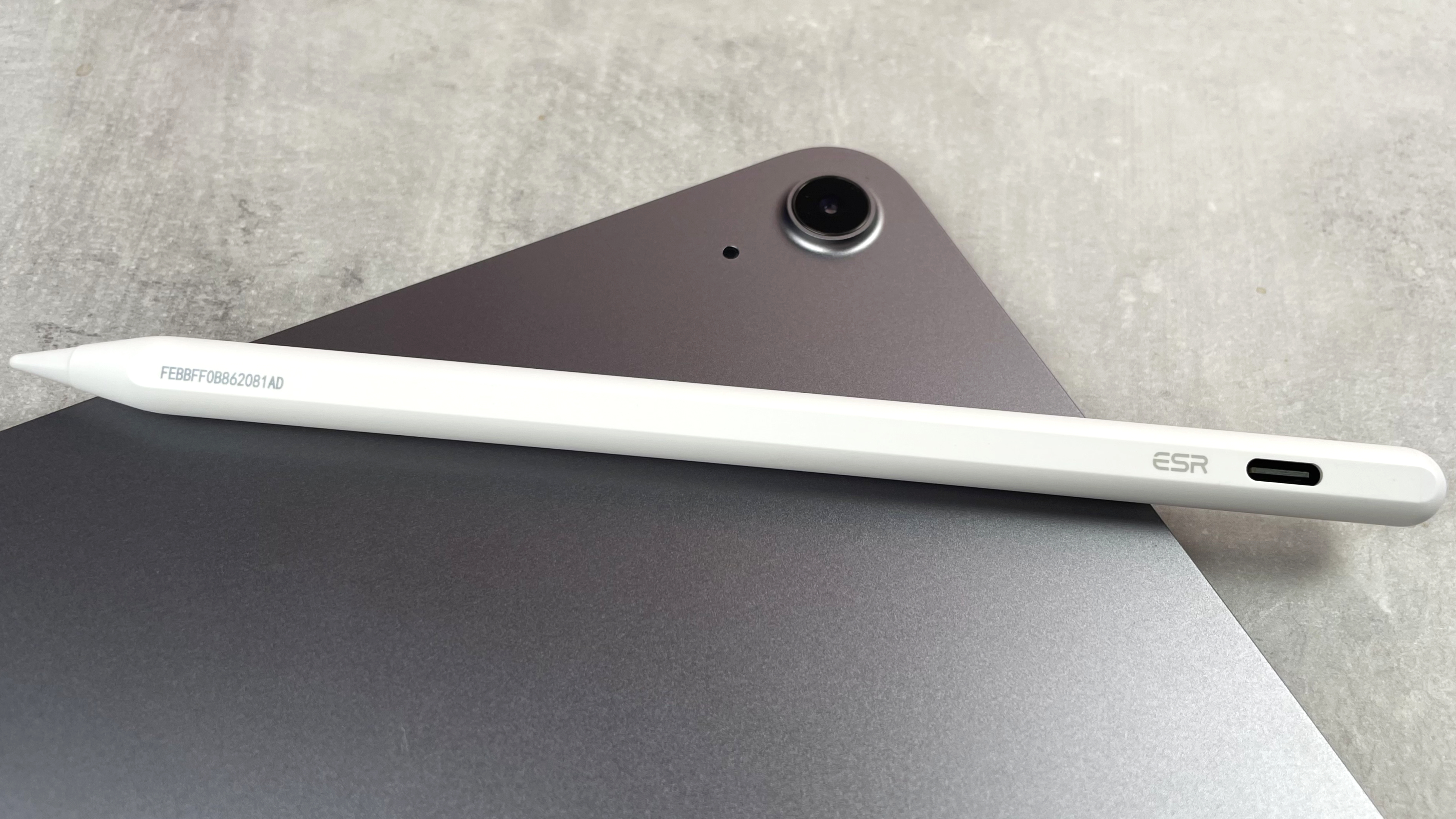 The ESR Geo Digital Pencil is pictured lying across the back of an iPad.