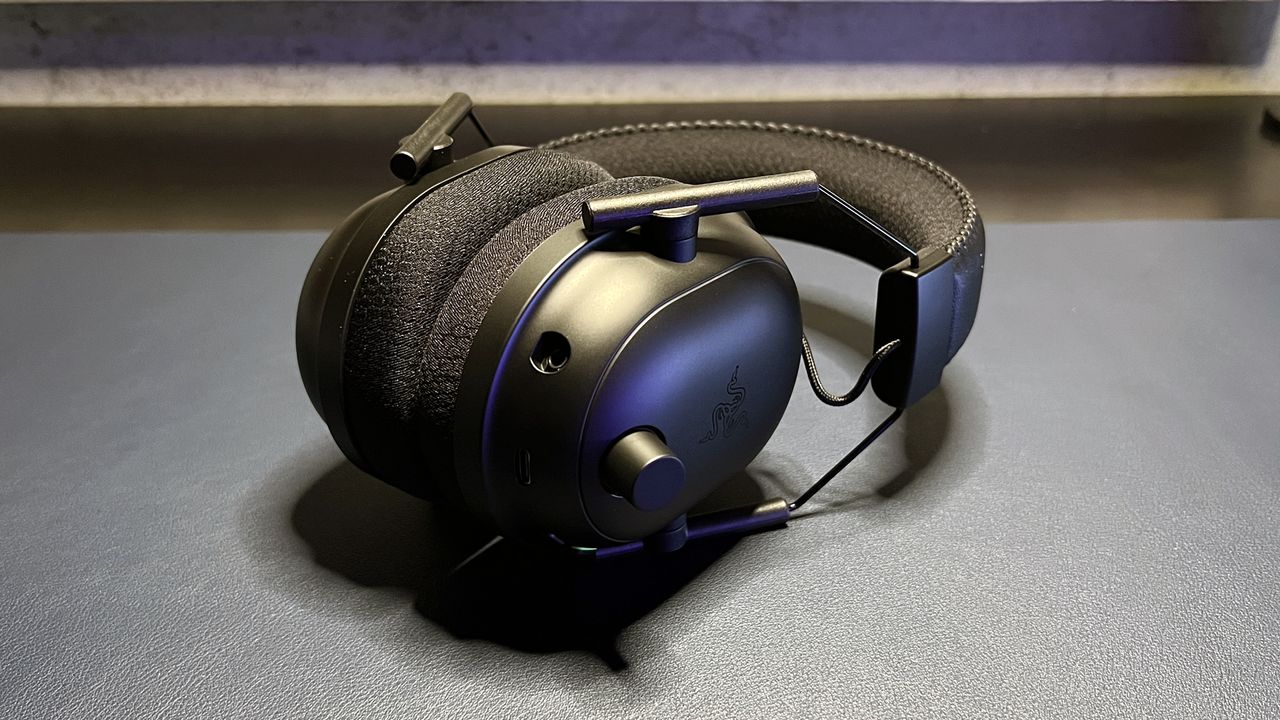 black razer headset on desk with volume knob