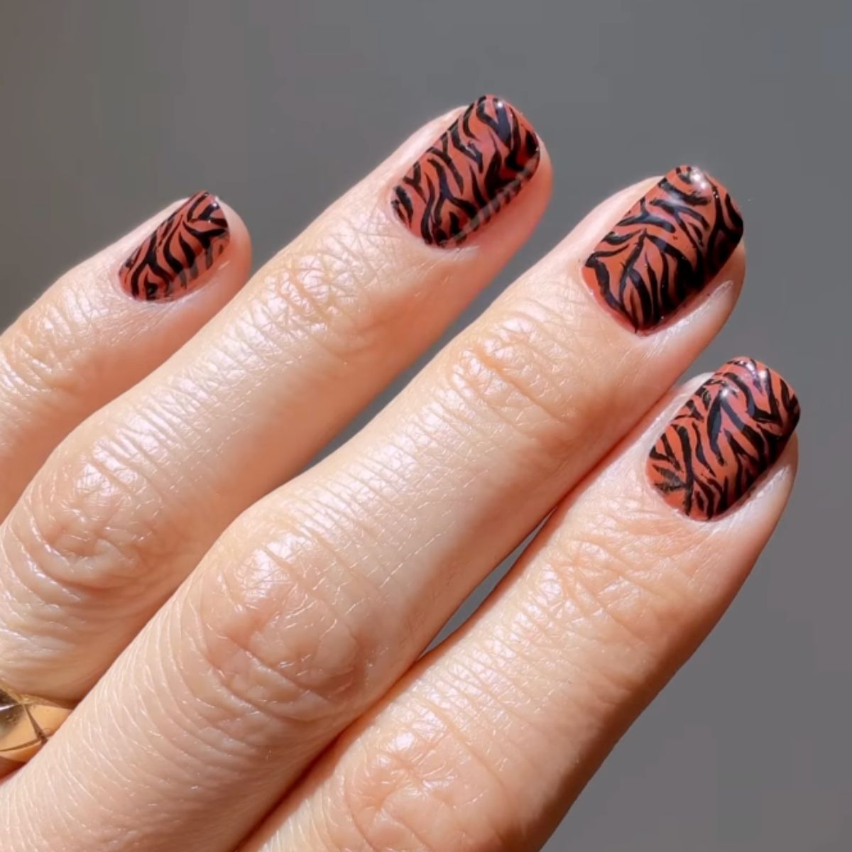 A tiger-striped manicure by celebrity manicurist Betina Goldstein.