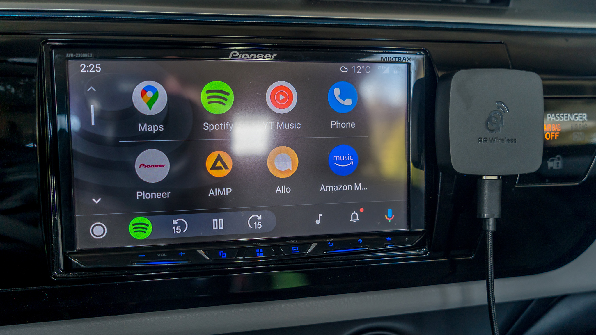 AAWireless next to Android Auto screen from a wider angle.