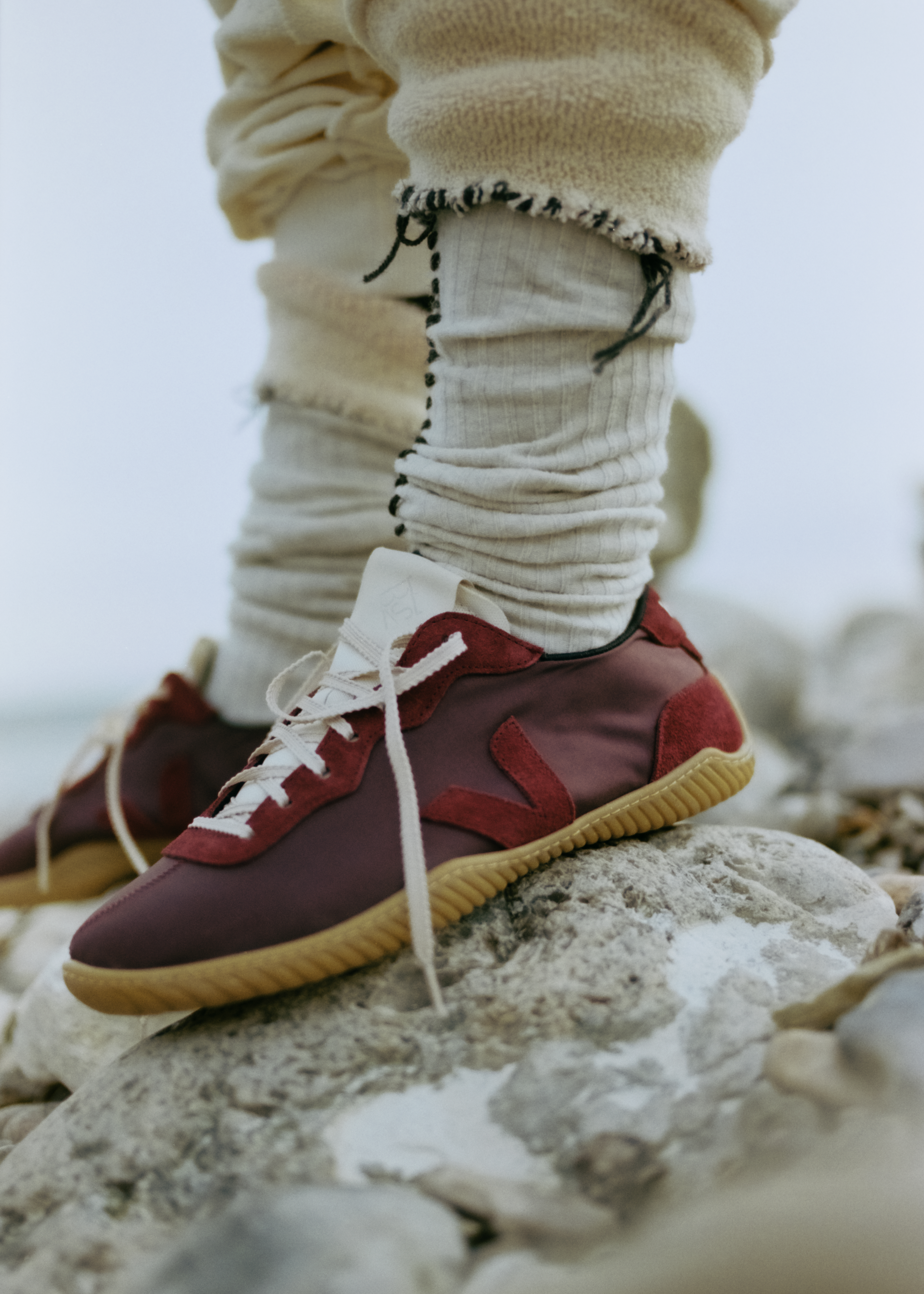 a close-up of the veja x baserange ballet sneaker