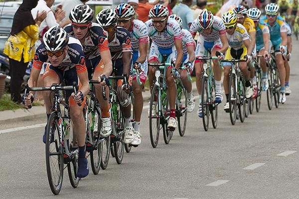 Chris Butler leads Champion Systems teammates Aaron Kemps and Anuar Manan at the front of the peloton.
