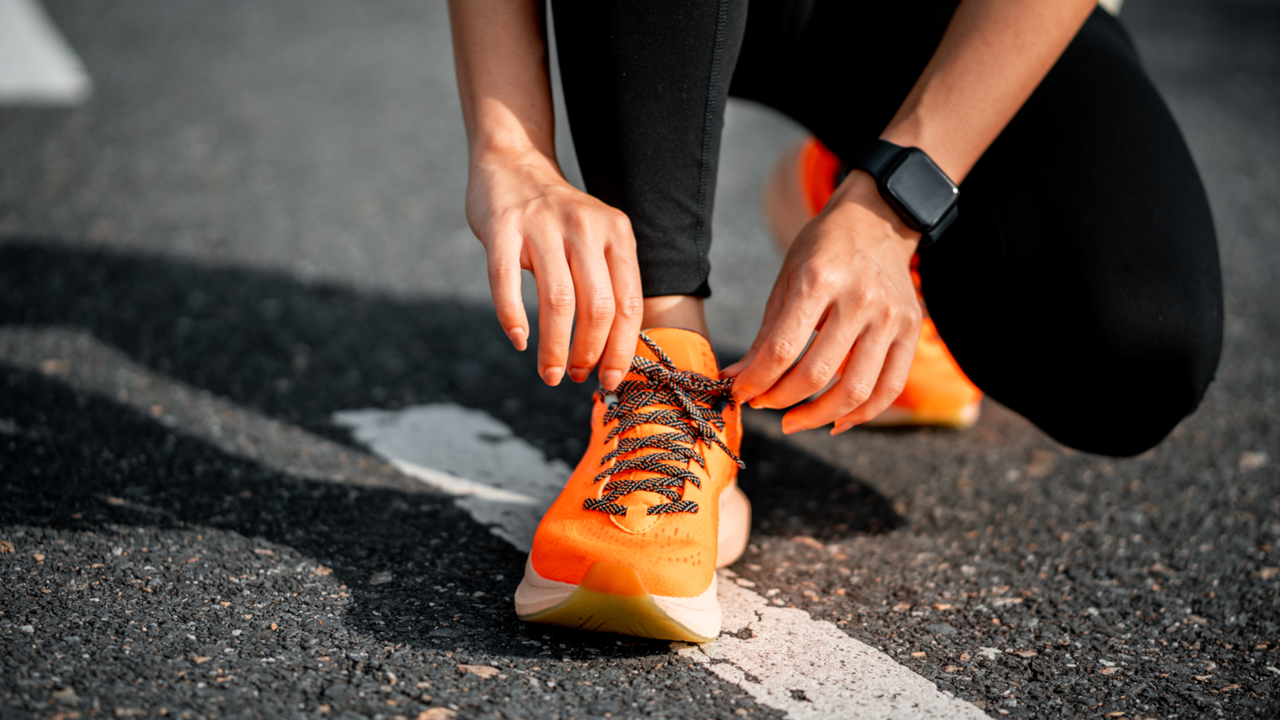 Running shoes&#039; laces being tied