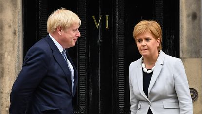 Boris Johnson standing next to Nicola Sturgeon