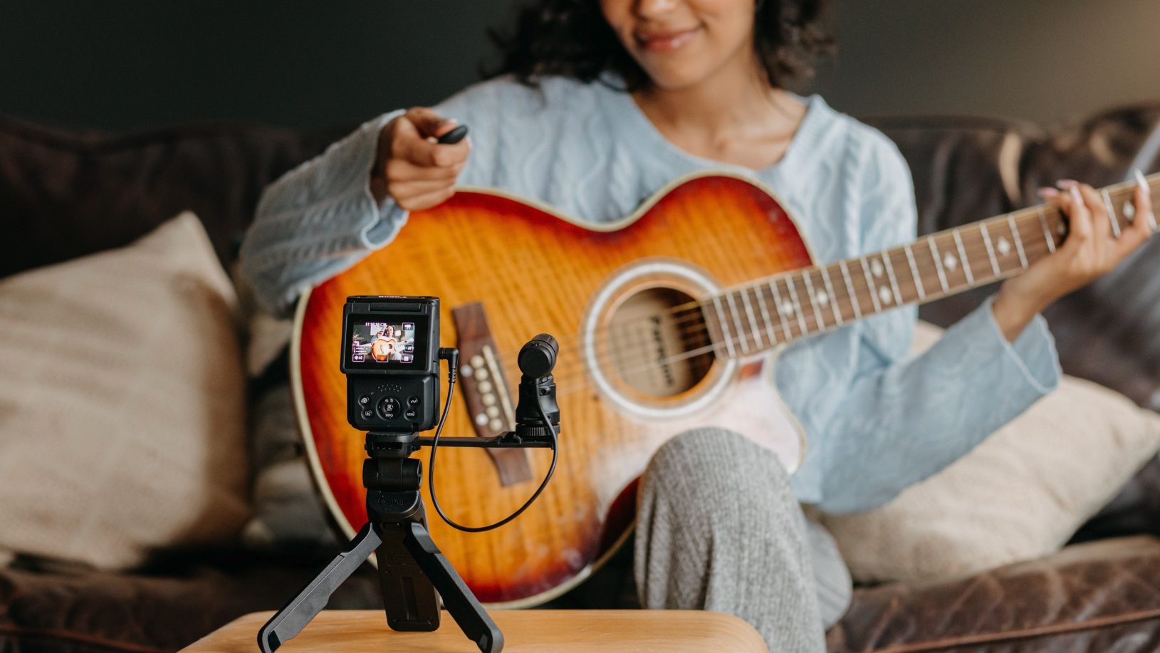Canon Powershot V10 vlogging camera filming a guitarist