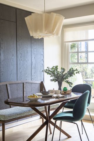 wood panelled modern dining room by Kitesgrove