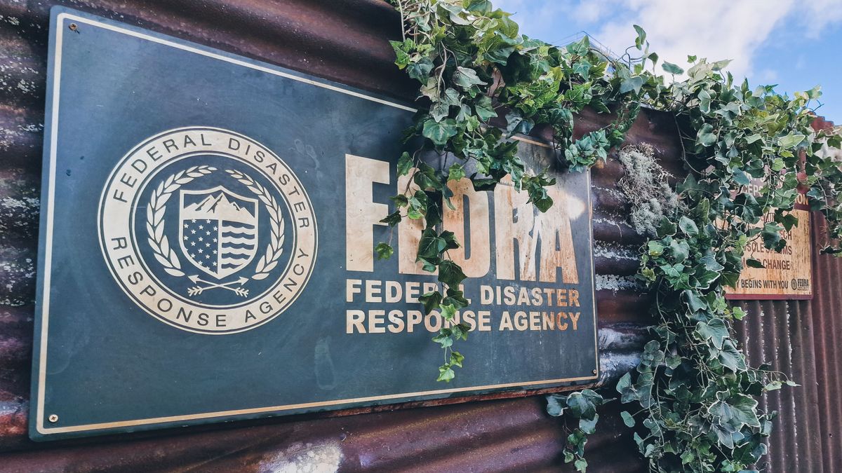 A shot of a FEDRA sign from the Last of Us show on a corrugated fence