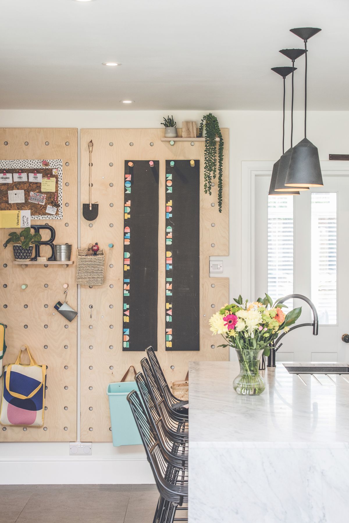 Pendant lights (the Circus range from Lighting Styles) and LED strip lights illuminate the craftsmanship in the kitchen and dining spaces.