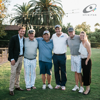 A group of golfers smiling at Spinitar's Golf for Hope.