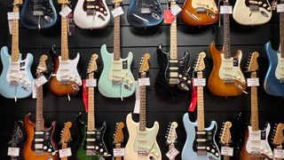 A wall of Fender guitars