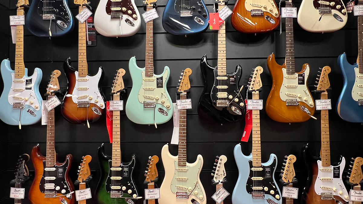 A wall of Fender guitars 