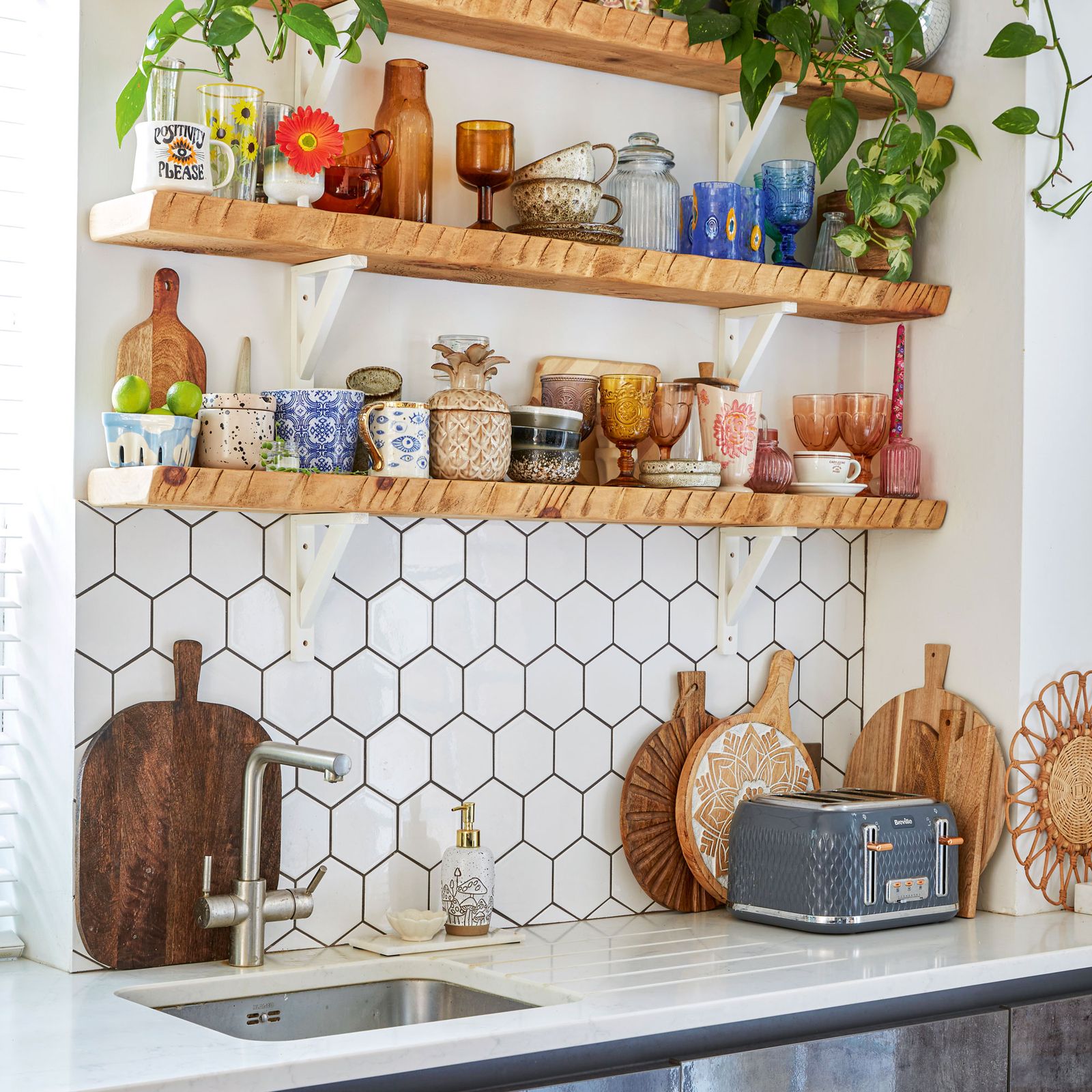 shelves-filled-with-glasses-and-vases-on-top-of-each-other