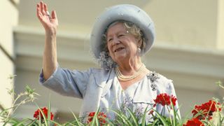 The Queen Mother waves to well-wishers during the celebration of her 90th birthday