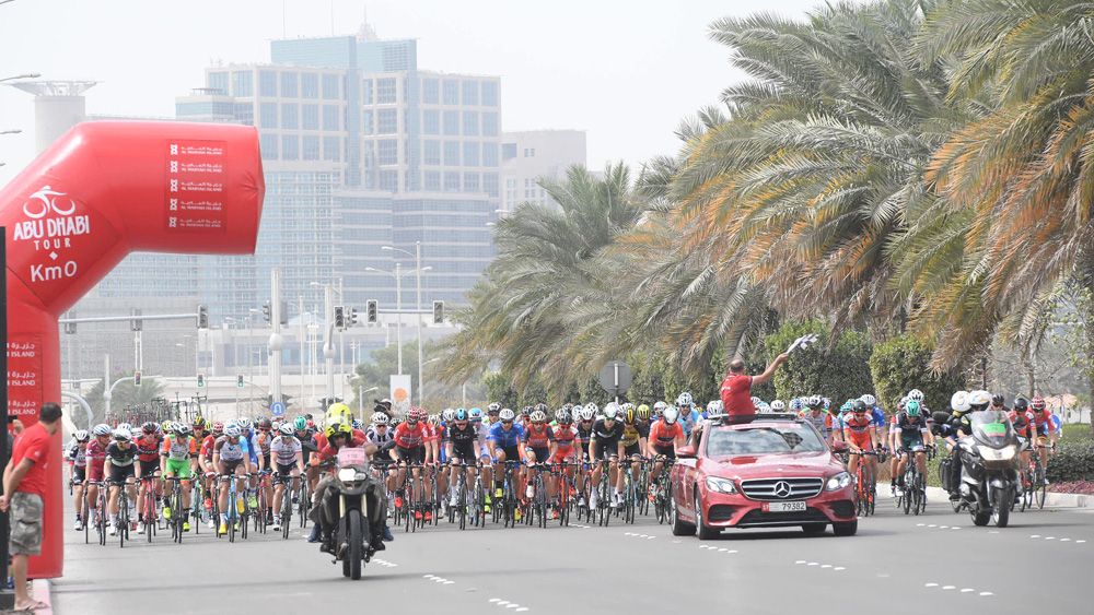 The peloton rolls through the start