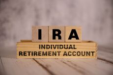 Light wooden blocks and cubes with the text IRA Individual Retirement Account