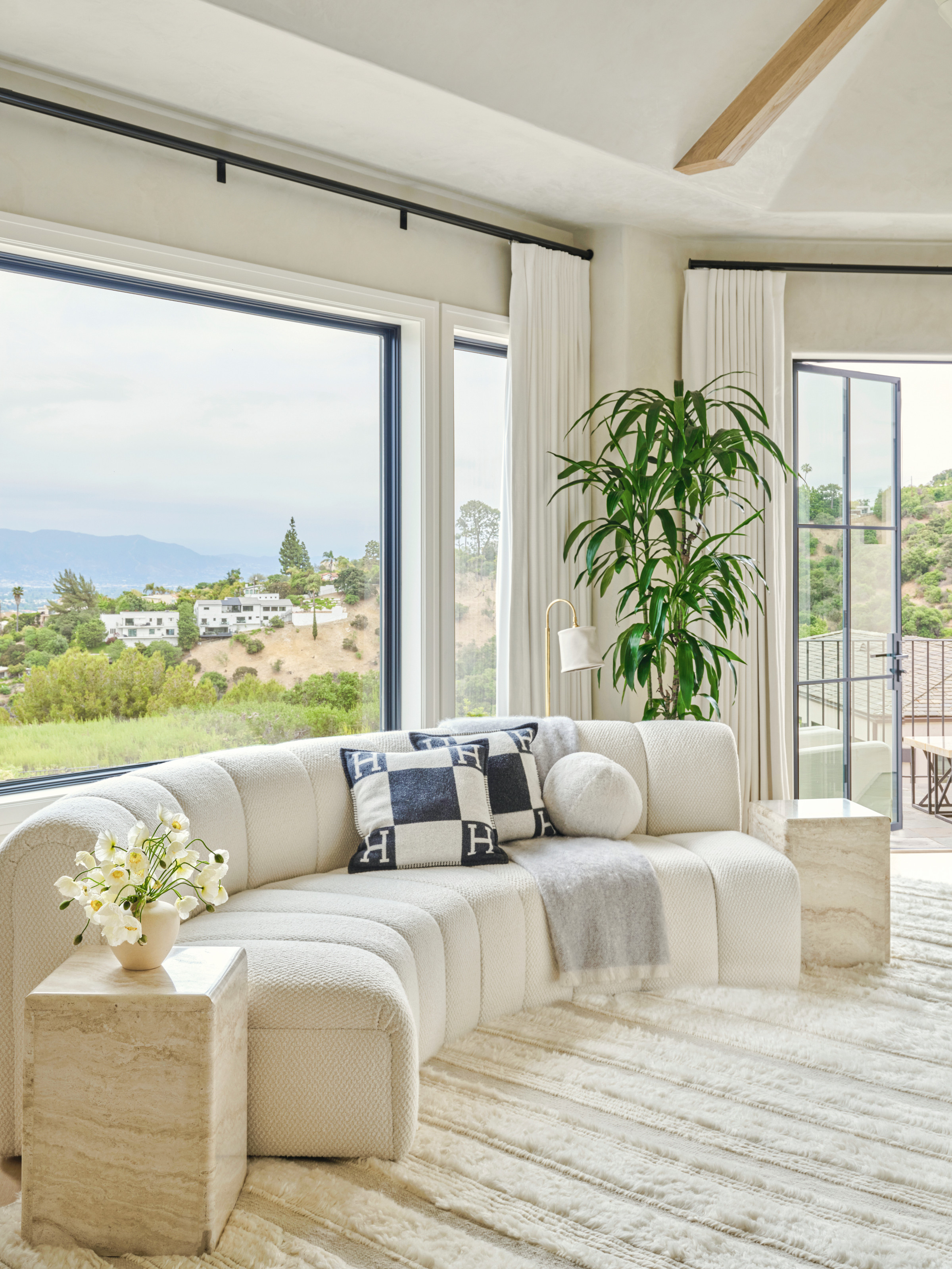 Seating area with curved white sofa