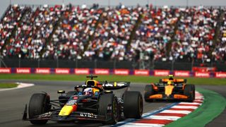 Max Verstappen of Red Bull Racing leading Lando Norris of McLaren at the F1 Grand Prix of Mexico at Autodromo Hermanos Rodriguez.
