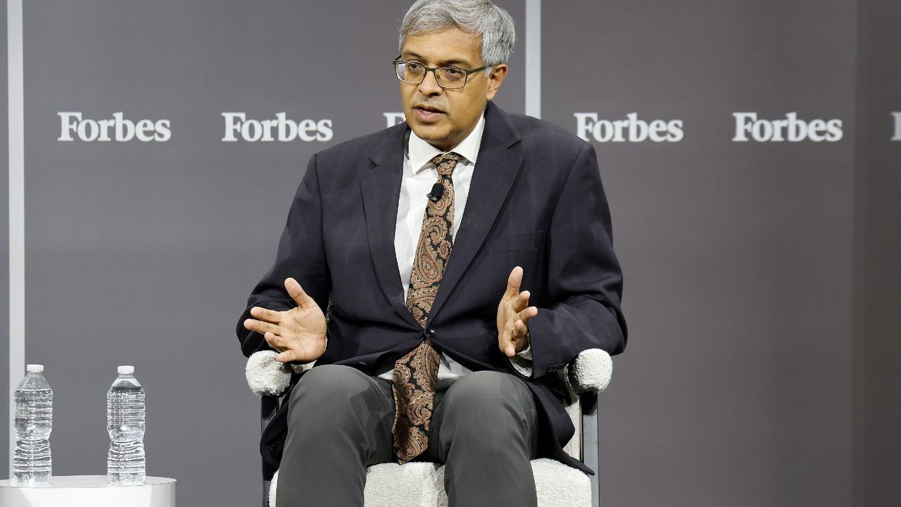 Jay Bhattacharya, seated, at a Forbes Healthcare Summit