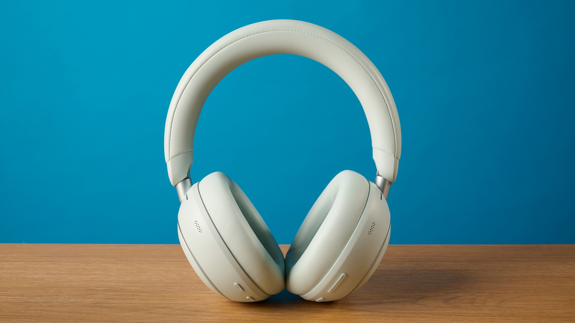 the soundcore space 2 headphones in white photographed against a blue tom's guide background