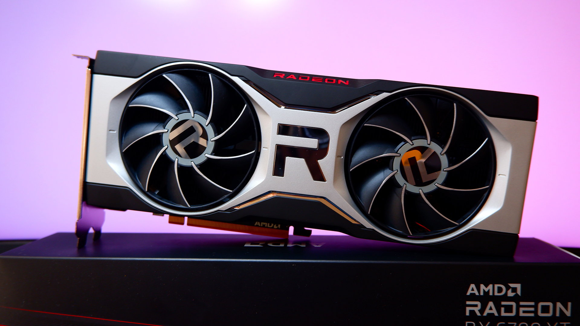 An AMD Radeon RX 6700 XT graphics card with a colourful gradient background