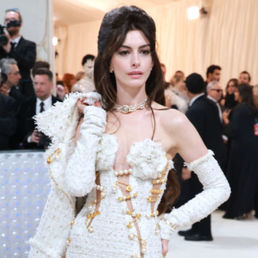 Anne Hathaway just wore an updated version of Liz Hurley’s iconic Versace pin dress—and we’re obsessed.