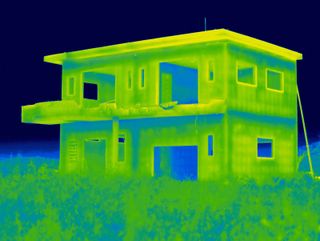 Heat style photograph on half built home.