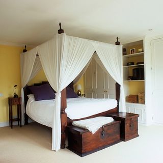 bedroom with bed and curtains on bed