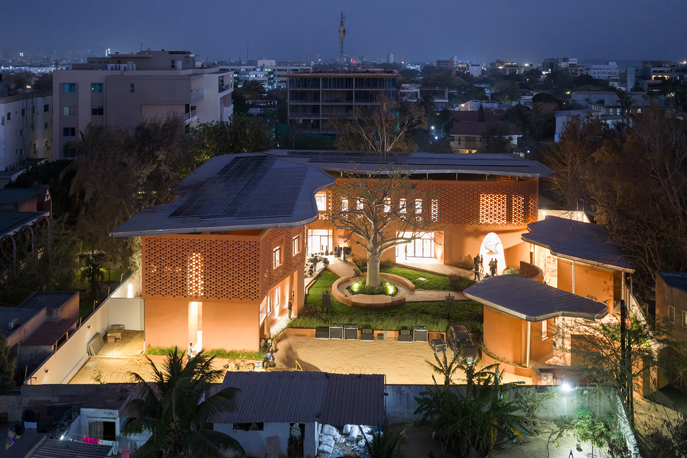 Goethe-Institut Dakar, brown earth block forms with wavy roofs designed by Francis Kere