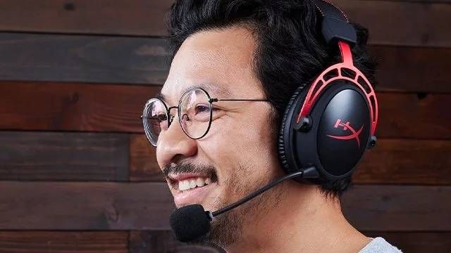 Man wearing HyperX Cloud Alpha Wireless headset