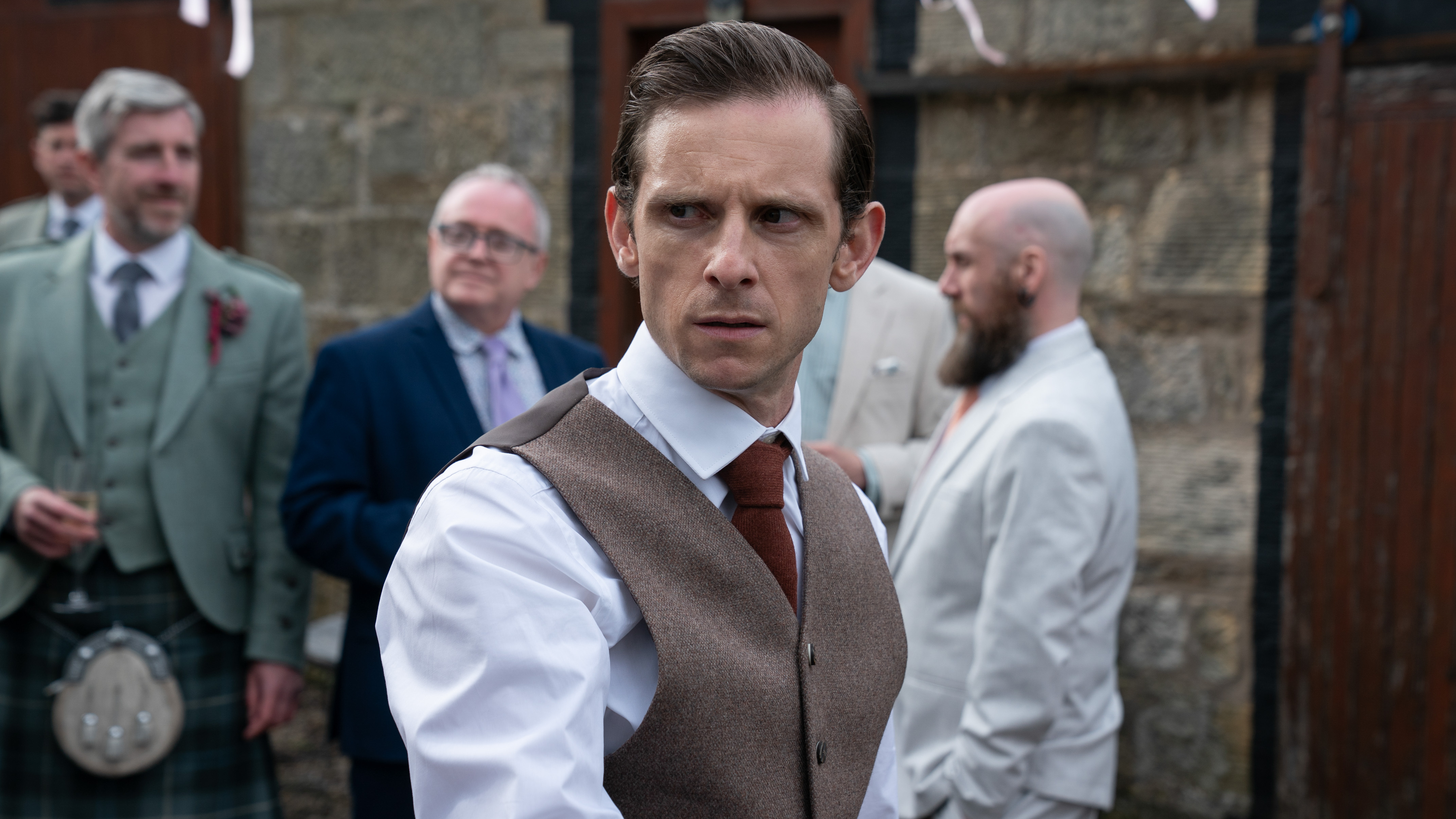 Niall (Jamie Bell) in formalwear in a scene from 