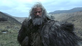 Hugh Jackman with a beard staring ahead in The Death of Robin Hood
