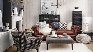 black and white living room with tan leather sofa