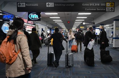 Travlers at Dulles International Airport on Sunday.