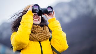 reasons you need binoculars: woman with bins