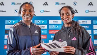 Sheila Chepkirui from Kenya and Tigist Assefa from Ethiopia holding the Adidas Running Shoes Adizero Adios Pro Evo 1 Lightstrike Pro at a press conference before the 2023 Berlin Marathon