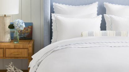 white pillows and bedding in bedroom