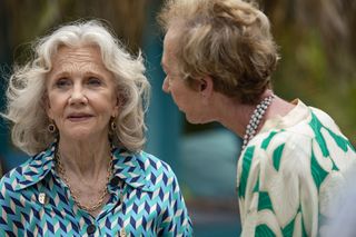 A still from Death In Paradise season 13 episode 2 showing Nancy (Hayley Mills) and Barbara (Ellie Haddington) having an argument. Nancy is looking off to the side while Barbara leans right in to Nancy's face.