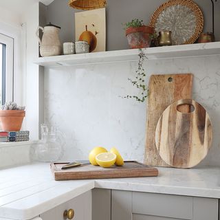 grey kitchen with marble splashback