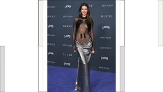 Kendall Jenner wearing a black mesh top and long silver skirt at the 11th Annual LACMA Art + Film Gala at Los Angeles County Museum of Art on November 05, 2022 in Los Angeles, California.