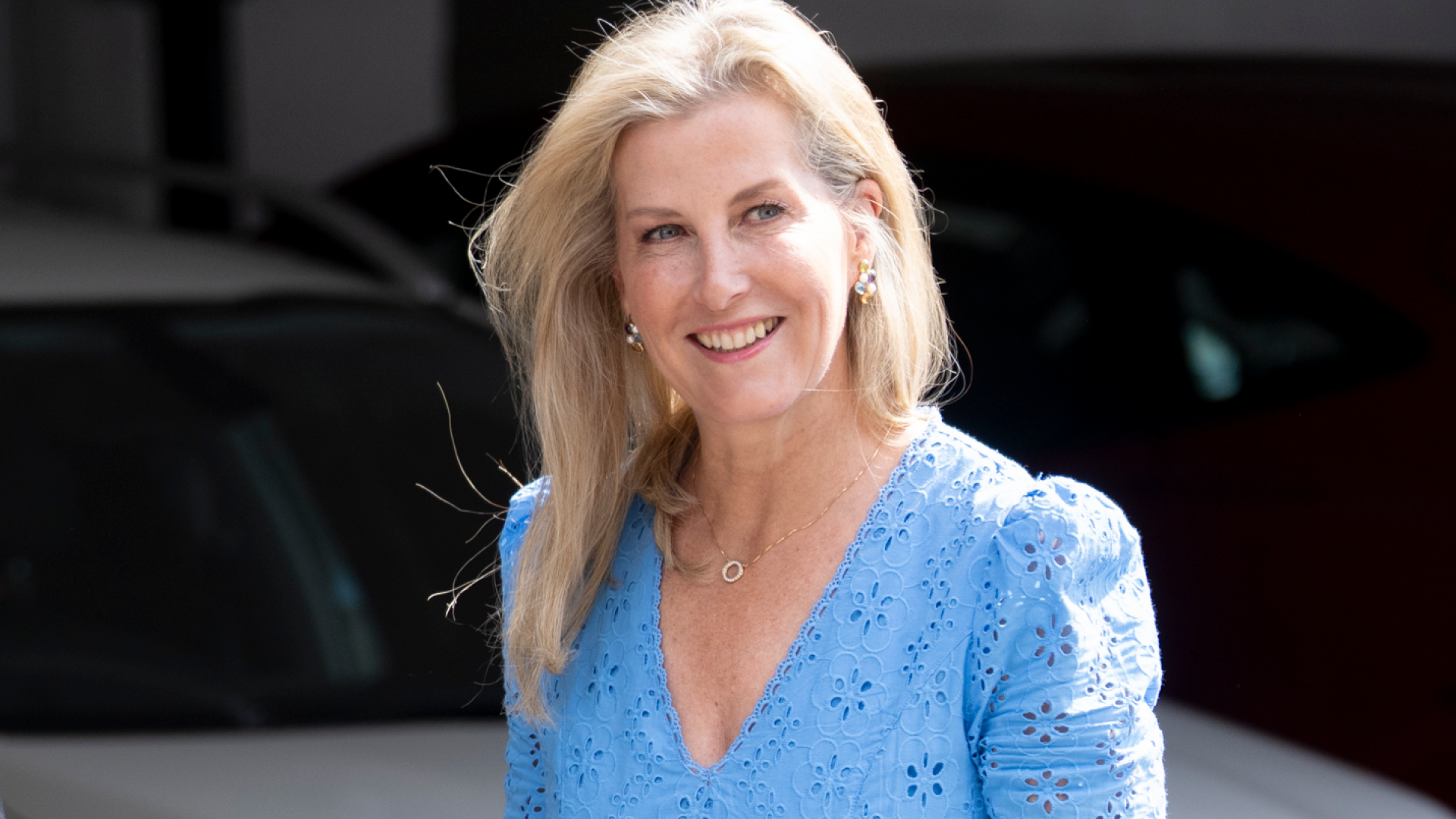 Duchess Sophie wearing a blue eyelet dress smiling